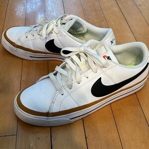 Nike White Low-Top Sneakers with Black Swoosh and Brown Trim